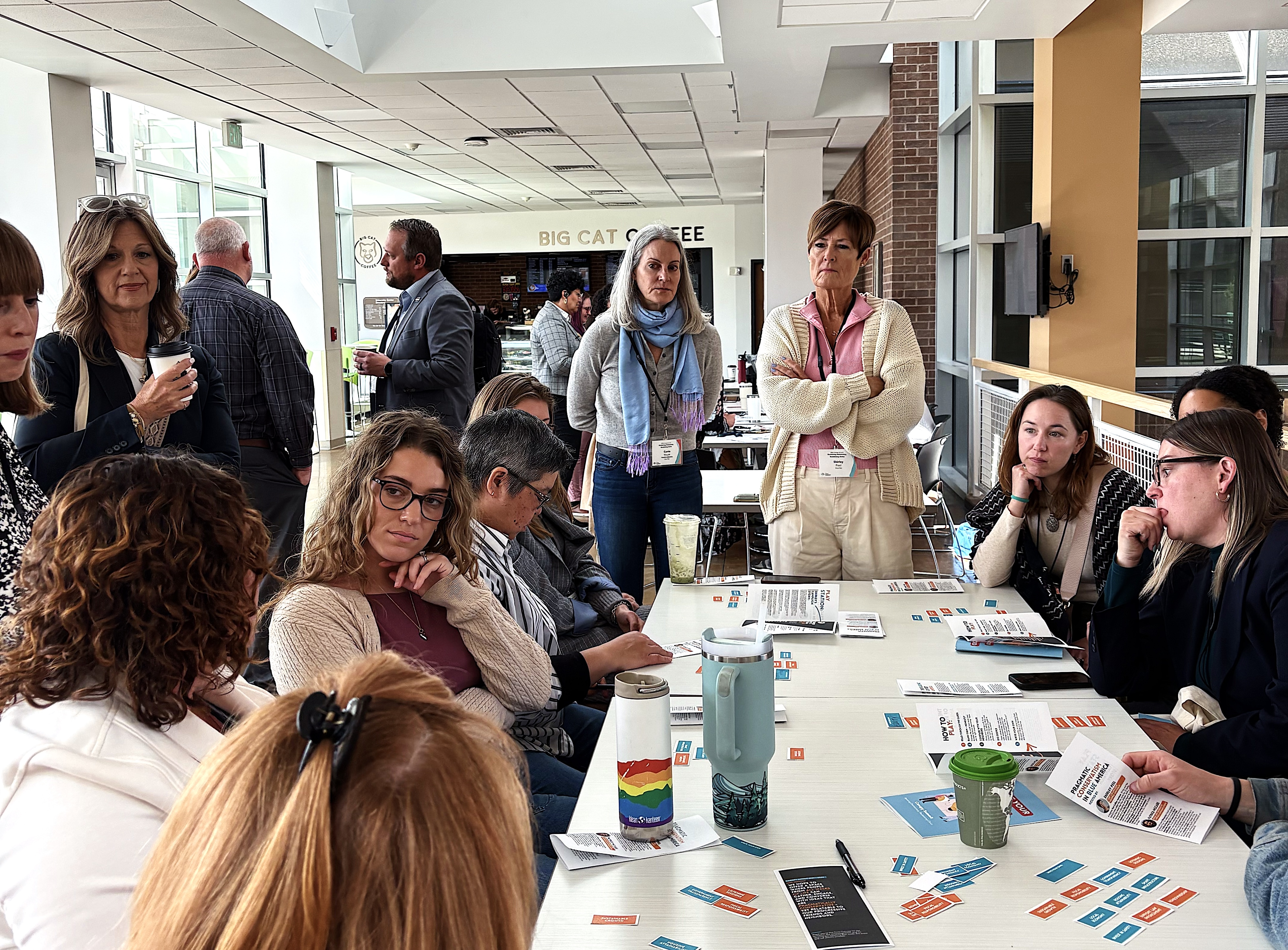 Participants working through a packet at a public forum